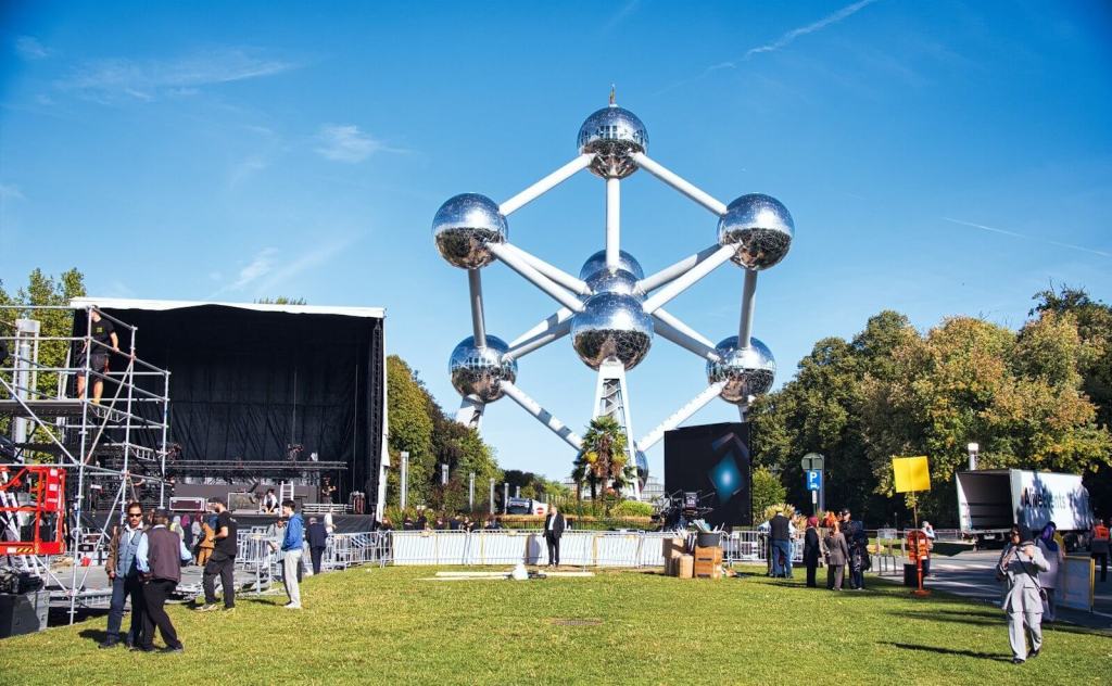 The atomium structure with people gathered outdoors